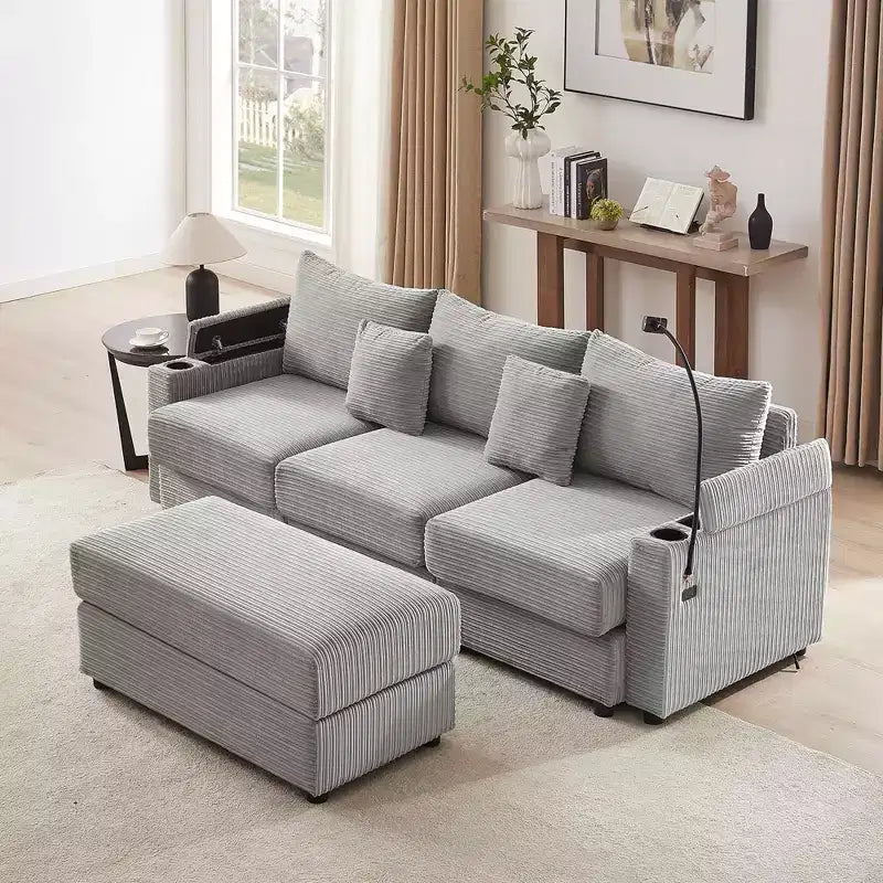 Divano a 3 posti in velluto grigio con pouf contenitore e porte USB
